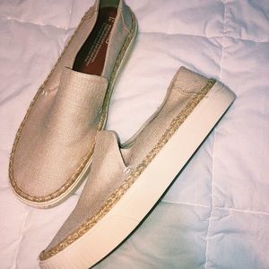 Brand new Toms w/out tags, cream colored slip ons